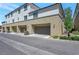 Exterior elevation of multi-story homes showcasing attached garages, manicured landscaping, and neutral paint for modern curb appeal at 12348 Golden Wreath Rd # 1, Las Vegas, NV 89183