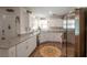 Bright kitchen with white cabinets, granite countertops, and stainless steel appliances at 12348 Golden Wreath Rd # 1, Las Vegas, NV 89183