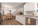 Modern kitchen with granite countertops seamlessly flowing into the dining area, perfect for entertaining at 12348 Golden Wreath Rd # 1, Las Vegas, NV 89183