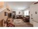 Spacious living room featuring stylish decor and wood-style flooring, creating a warm ambiance at 12348 Golden Wreath Rd # 1, Las Vegas, NV 89183