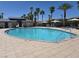 Inviting community pool with refreshing water, lounge chairs, and swaying palm trees at 12348 Golden Wreath Rd # 1, Las Vegas, NV 89183