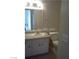 Bathroom with white vanity and large mirror providing practicality and ample lighting at 1405 Vegas Valley Dr # 378, Las Vegas, NV 89169