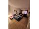 Cozy bedroom featuring tiled floors and a comfortable bed with natural light at 1405 Vegas Valley Dr # 378, Las Vegas, NV 89169