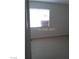 Simple bedroom with a window bringing natural light and tile flooring providing easy cleaning at 1405 Vegas Valley Dr # 378, Las Vegas, NV 89169