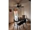 Bright dining area with black table, chairs, ceiling fan, and natural light at 1405 Vegas Valley Dr # 378, Las Vegas, NV 89169
