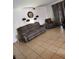 Living room featuring a sofa and armchair, with tiled floors and decorative elements at 1405 Vegas Valley Dr # 378, Las Vegas, NV 89169