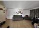 Neutral living room with tiled floors, ample seating, and natural light at 1405 Vegas Valley Dr # 378, Las Vegas, NV 89169
