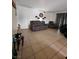 Comfortable living room featuring a recliner sofa, tiled flooring, and accent decor at 1405 Vegas Valley Dr # 378, Las Vegas, NV 89169