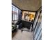 A covered patio with sliding glass doors and a metal safety railing at 1405 Vegas Valley Dr # 378, Las Vegas, NV 89169