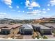 View of the home and neighborhood, with mountain views in the background at 171 Palm Fox Ct, Henderson, NV 89011
