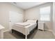 Inviting bedroom with a cozy bed, natural light, and neutral walls at 171 Palm Fox Ct, Henderson, NV 89011