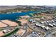 Aerial view showcasing a lakefront community with modern homes and lush landscaping at 171 Palm Fox Ct, Henderson, NV 89011