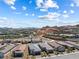 Beautiful view of the community with modern homes, desert landscaping and mountains in the background at 171 Palm Fox Ct, Henderson, NV 89011