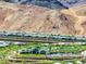 Gorgeous aerial view of a Primary planned community with mature trees and meticulously maintained landscaping in a desert setting at 171 Palm Fox Ct, Henderson, NV 89011