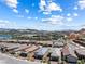 Scenic community view showcasing modern homes, mountain views, and blue sky at 171 Palm Fox Ct, Henderson, NV 89011