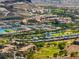 Aerial view of a community near a golf course and lake at 171 Palm Fox Ct, Henderson, NV 89011