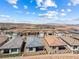 Aerial view of homes with patios, desert landscaping, and a mountain backdrop at 171 Palm Fox Ct, Henderson, NV 89011