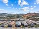 Community view with modern homes, desert landscaping and mountains in background at 171 Palm Fox Ct, Henderson, NV 89011
