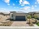 Charming single-story home featuring a brick driveway and desert landscaping at 171 Palm Fox Ct, Henderson, NV 89011