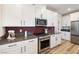 Well-equipped kitchen featuring stainless steel appliances, a gas range, and sleek hardware at 171 Palm Fox Ct, Henderson, NV 89011