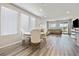 Bright living space with wood floors, dining area, and comfortable seating at 171 Palm Fox Ct, Henderson, NV 89011