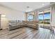 Spacious living room with large sectional sofa and sliding glass doors showcasing scenic views at 171 Palm Fox Ct, Henderson, NV 89011