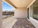 Covered outdoor patio featuring beautiful brick flooring and sliding glass doors at 171 Palm Fox Ct, Henderson, NV 89011
