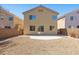 Rear exterior showing a simple desert landscaped backyard with a patio at 180 Duck Hollow Ave, Las Vegas, NV 89148