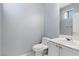 Powder room featuring a toilet and sink at 180 Duck Hollow Ave, Las Vegas, NV 89148