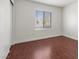 Bedroom with wood floors, a window, and a closet at 180 Duck Hollow Ave, Las Vegas, NV 89148