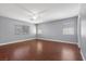 Large bedroom with plank floors and natural light at 180 Duck Hollow Ave, Las Vegas, NV 89148