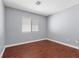 Bedroom with wood floors and a window at 180 Duck Hollow Ave, Las Vegas, NV 89148