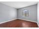 Bedroom with wood floors and a window at 180 Duck Hollow Ave, Las Vegas, NV 89148
