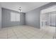 Open-concept dining area with tile flooring and modern light fixture at 180 Duck Hollow Ave, Las Vegas, NV 89148