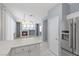 Modern kitchen view with stainless steel refrigerator at 180 Duck Hollow Ave, Las Vegas, NV 89148