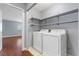 Laundry room including shelving, a washer, and a dryer at 180 Duck Hollow Ave, Las Vegas, NV 89148