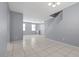Spacious living room with neutral paint and tiled floors at 180 Duck Hollow Ave, Las Vegas, NV 89148