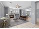 Bright living room featuring a fireplace, neutral tones, modern furniture, and tile flooring at 180 Duck Hollow Ave, Las Vegas, NV 89148