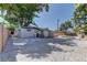 A spacious backyard featuring zero-scaping, mature landscaping, and privacy fence at 1901 Farnam Pl, Las Vegas, NV 89102