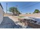 This backyard offers a stone tile patio, zero-scaping and manicured patch of grass at 1901 Farnam Pl, Las Vegas, NV 89102