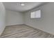 This bedroom offers wood-look floors, a window, and fresh neutral paint at 1901 Farnam Pl, Las Vegas, NV 89102