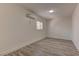 This bedroom offers wood-look floors, a window, and fresh neutral paint at 1901 Farnam Pl, Las Vegas, NV 89102