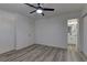 A bedroom leads into an en suite bathroom and features neutral colors and laminate flooring at 1901 Farnam Pl, Las Vegas, NV 89102