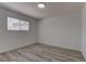 This bedroom offers wood-look floors, a window, and fresh neutral paint at 1901 Farnam Pl, Las Vegas, NV 89102