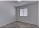 This bedroom offers wood-look floors, a window, and fresh neutral paint at 1901 Farnam Pl, Las Vegas, NV 89102