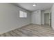 Bright bedroom includes wood-look floors, window, fresh neutral paint and a closet at 1901 Farnam Pl, Las Vegas, NV 89102