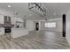 Stylish and bright kitchen flows into a large living space with a fireplace feature at 1901 Farnam Pl, Las Vegas, NV 89102