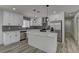 Modern kitchen with stainless steel appliances, island, and ample storage at 1901 Farnam Pl, Las Vegas, NV 89102