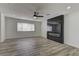Bright living room featuring a fireplace, and modern flooring at 1901 Farnam Pl, Las Vegas, NV 89102