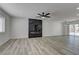 Open living space with modern fireplace, beautiful flooring, and bright lighting at 1901 Farnam Pl, Las Vegas, NV 89102